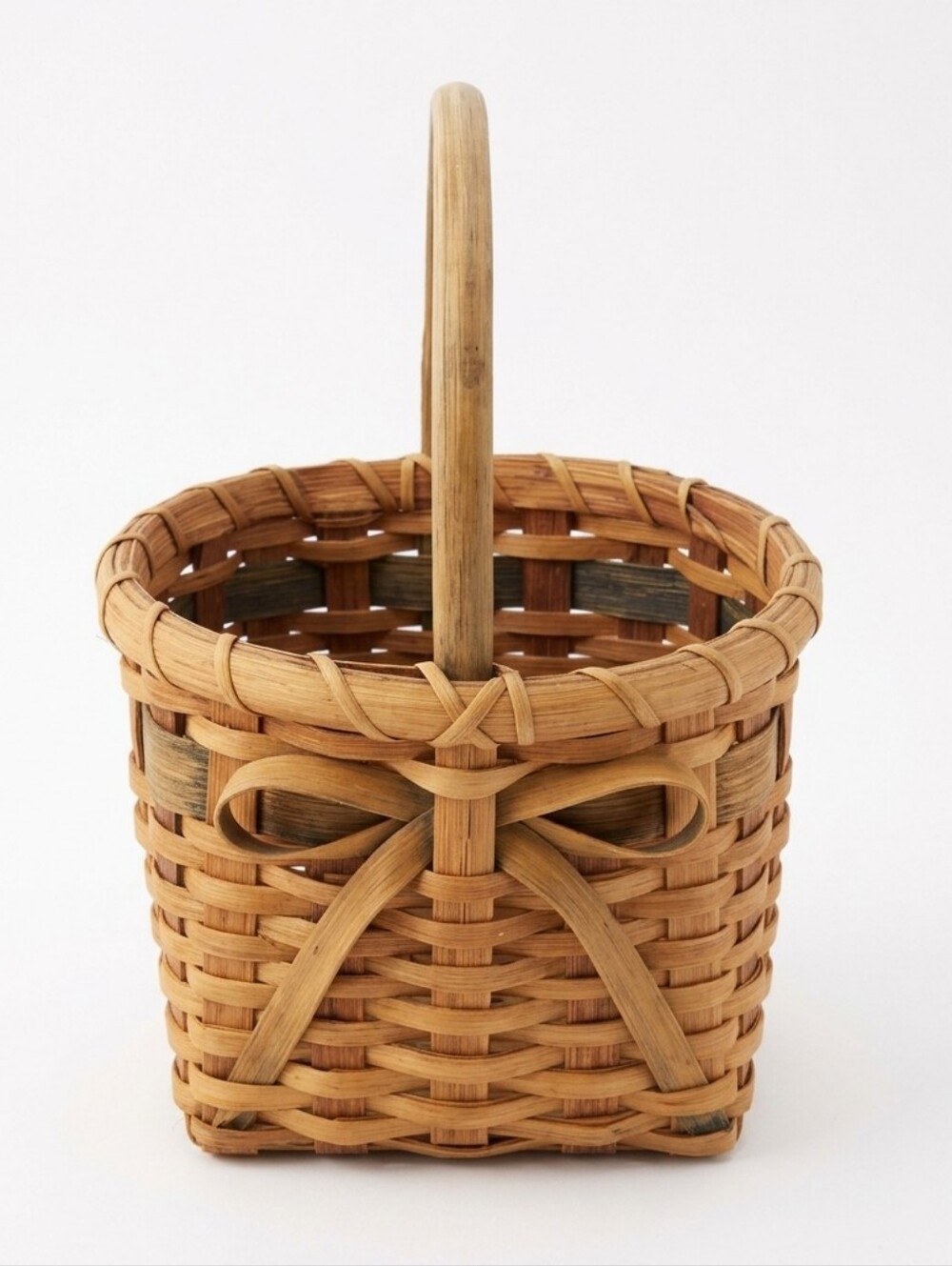Vintage, Hand-Woven Basket Featuring A Unique Bow Detail And Green Accent
